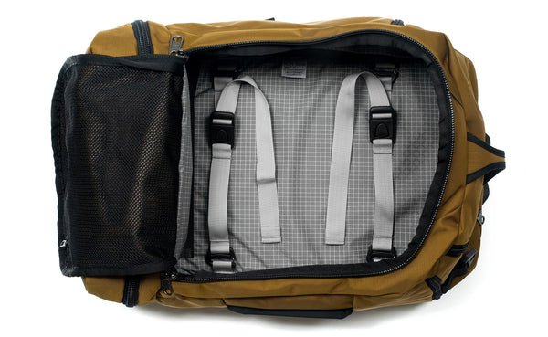 A Techonaut 30 with a Coyote (sand brown) exterior with Northwest Sky (light grey with white grid pattern) 200 Halcyon interior.